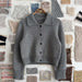 Petra Jacket Knitting Pattern, a grey knitted jacket with collar, button front and ribbed cuffs and hem