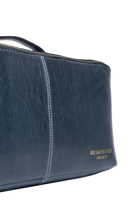 Sapphire blue leather knitting project bag with dedicated tool sections and handcrafted design